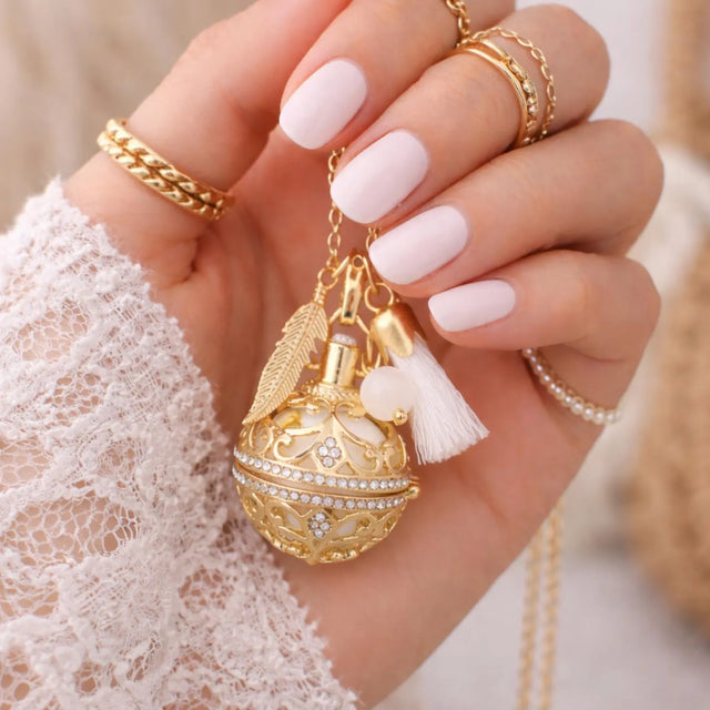 Bola de grossesse doré cage strass plumpe pompon perle pierre de lune 