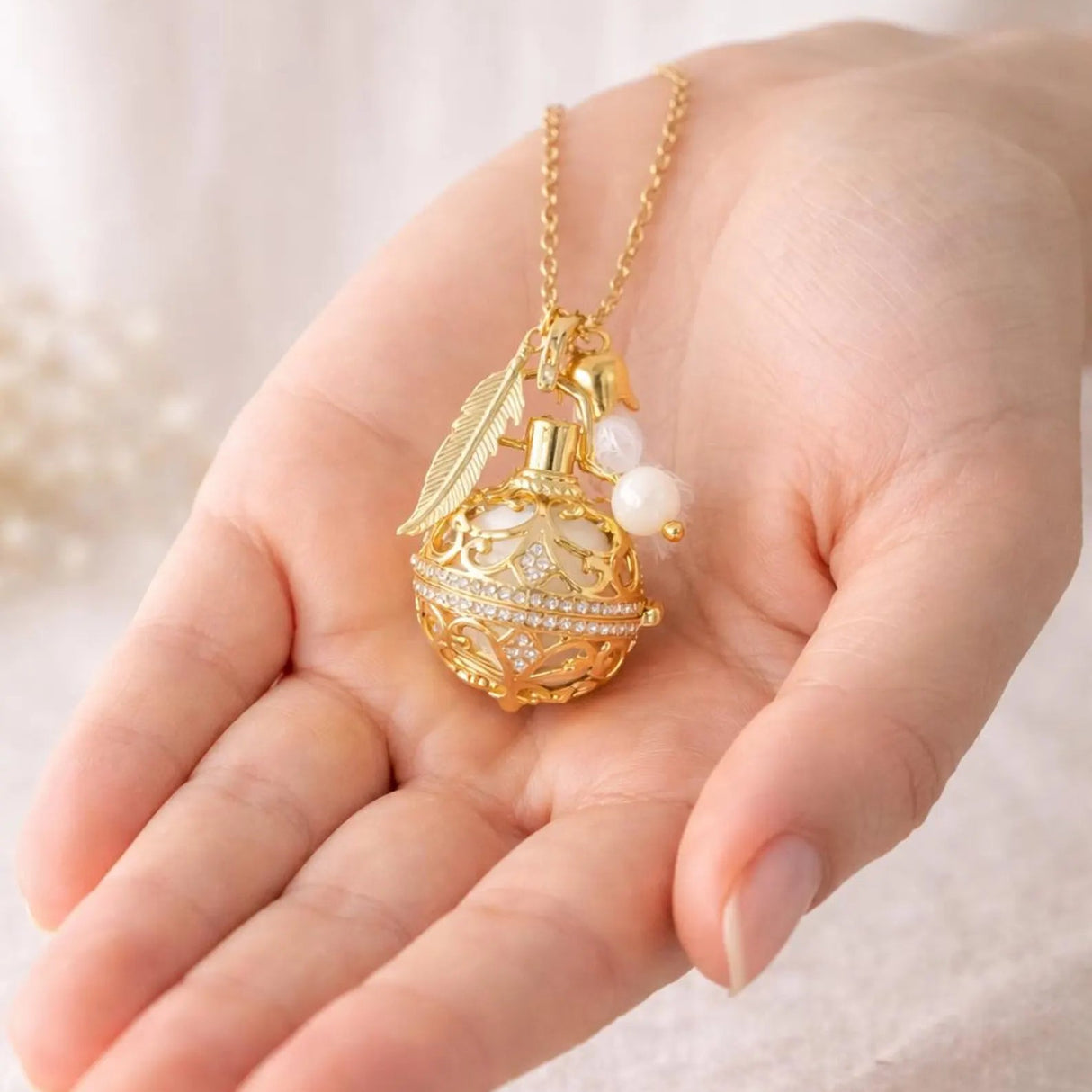 Bola de grossesse doré cage strass plumpe pompon perle pierre de lune 