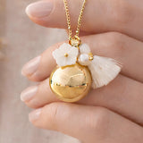 Bola de grossesse doré fleur nacre pompon perle d'eau douce